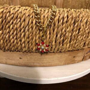 Red snowflake and gold bracelet